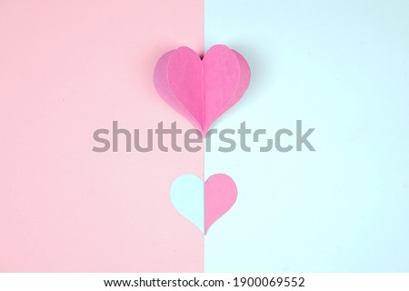 Heart shaped paper sticked on paper. Emblem of love for happy women, beloved mother, birthday cards and valentine greeting designs. Valentine's day backgrounds. Templates to convey our love.