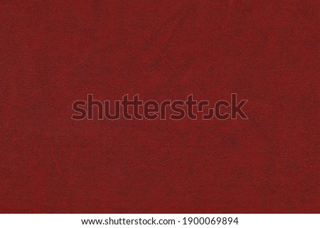 Red maroon background textured artificial leather surface