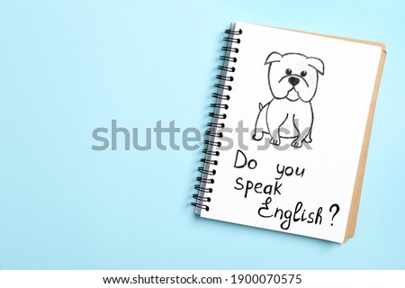 Notebook with question Do You Speak English on light blue background, top view. Space for text