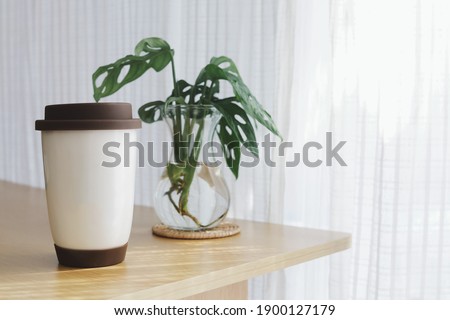 Mock up white coffee mug on table with copy space.