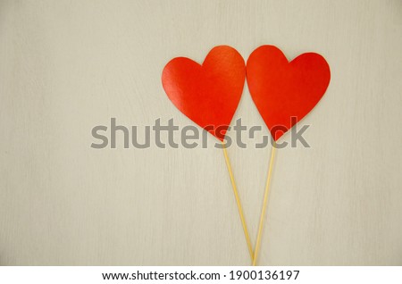  two hearts lie on a yellow background. valentine's day concept. High quality photo