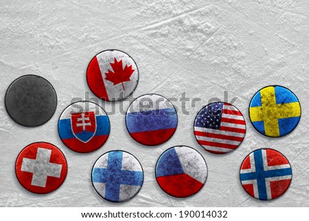 Lying on a hockey rink puck with images of national flags 