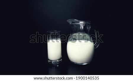 Carafe and glass containing fresh milk