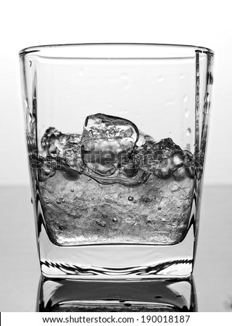 Ice and water in glass, monotone color