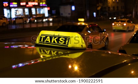 Close up of Istanbul taxi at night. The word "taksi" translated from Turkish means "taxi". Royalty-Free Stock Photo #1900222591