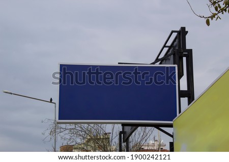 Empty billboards in blue and yellow colors
