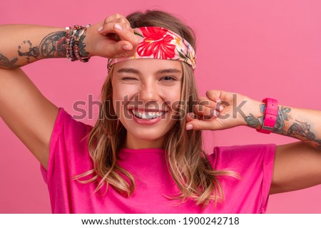 pretty cute smiling woman in pink shirt boho hippie style accessories smiling emotional fun posing on pink background isolated positive mood