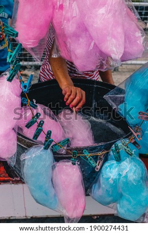 Pink and blue cotton candy in the making
