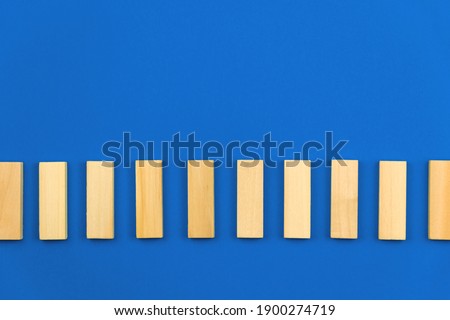 Template for business vision and development concept, blue background, copy space, vertical wooden blocks. High quality photo