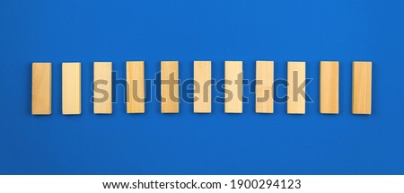 Template for business vision and development concept, blue background, copy space, vertical wooden blocks. High quality photo