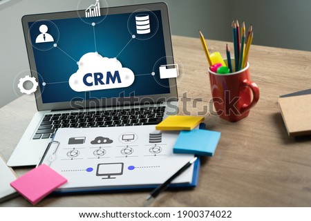 CRM Business Customer CRM Management Analysis Service Concept Business team hands at work with financial reports and a laptop Royalty-Free Stock Photo #1900374022
