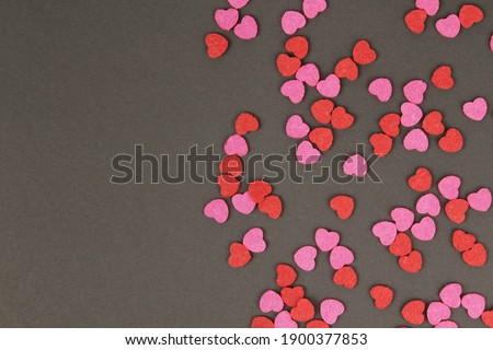 Hearts abstract background in red pink colors, on black texture - Happy Valentine's Day - Hearts Love pattern