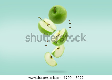Stack of green Apple falling or flying.Creative levitation food
