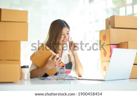 Startup small businessnworking with computer at workplace. Freelance woman seller check product order.market place.Online selling.Online Shopping. SME,E-commerce.