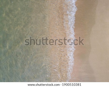 Aerial top view of sky Double bokeh sponge and tsunami is blowing to the shore.Use for website banner background, backdrop,Shot from drone. 