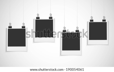 blank photo frame hanging on a line