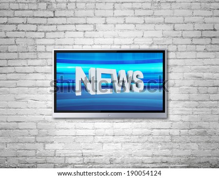 wide screen TV on brick wall with news