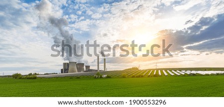 lignite power plant, solar power, wind turbines with cloudy sky panorama Royalty-Free Stock Photo #1900553296