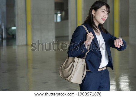 Japanese woman in a dark blue suit