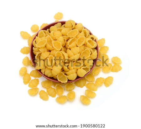 Close up of the background farfalle in wooden bowl