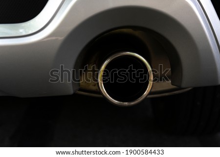 Close-up end of pipe car exhaust. for technology of transport background.