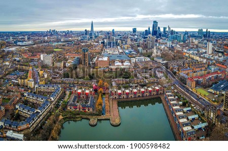 Aerial view of Shadwell Basin and the City of London, the historic centre and the primary central business district, UK
