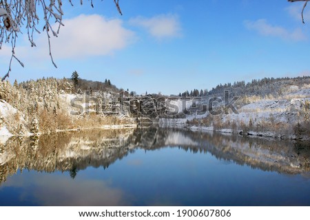 beautiful winter landscape with blue lake