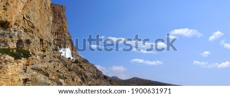 Ultra wide panoramic photo of famous Monastery of Hozoviotissa built in a steep rock in island of Amorgos, Cyclades, Greece