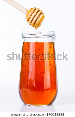 Honey diping and dipper isolated with white background