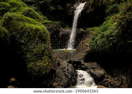 Travelling to Uci Waterfall, West Java Royalty-Free Stock Photo #1900643365