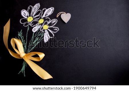 Postcard for the holiday of Valentine's Day, birthday, women's day. Blackboard with chalk-drawn flowers. Royalty-Free Stock Photo #1900649794