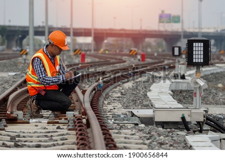 engineer Sitting on railway inspection. construction worker on railways. Engineer work on railway. rail, engineer, Infrastructure Royalty-Free Stock Photo #1900656844