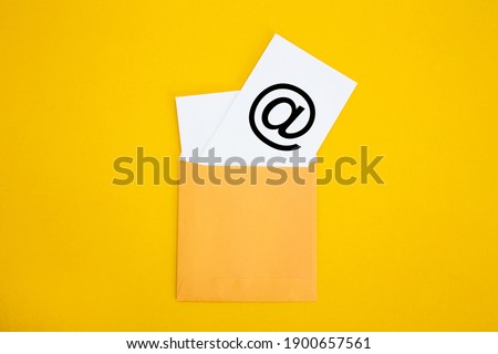 Envelope with email symbol on yellow background - Concept of corporate communication