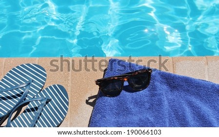 poolside pool towel beach shoes swimming pool summer holiday vacation scenic sunglasses and thong shoes flip flops stock, photo, photograph, picture, image
