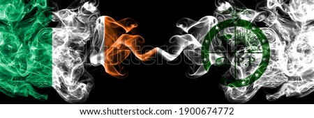 Republic of Ireland, Irish vs United States of America, America, US, USA, American, Pee Pee Township, Ohio smoky mystic flags placed side by side. Thick colored silky abstract smoke flags.