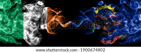 Republic of Ireland, Irish vs United States of America, America, US, USA, American, North Dakota smoky mystic flags placed side by side. Thick colored silky abstract smoke flags.
