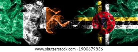 Republic of Ireland, Irish vs Dominica, Dominican smoky mystic flags placed side by side. Thick colored silky abstract smoke flags.