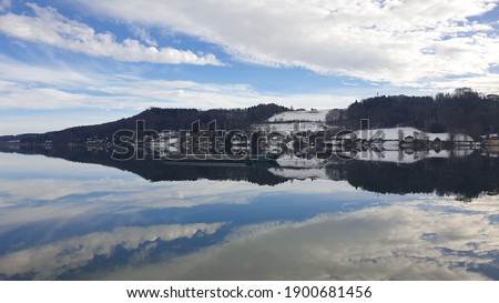 view of a lake called Mattsee in salzburg country the picture was taken on a cold day in january 