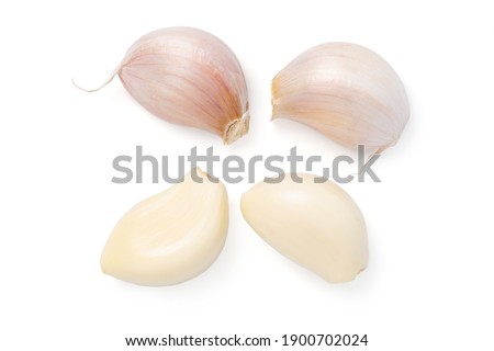 Top view fresh peeled garlic cloves, bulb  with garlic slices isolated on white background. clipping path. Royalty-Free Stock Photo #1900702024