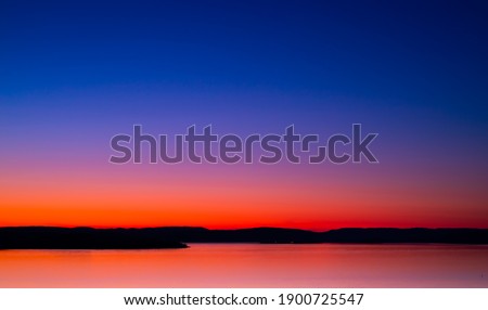Quiet and romantic sunset at sea side. Fits very well as background or as a poster.