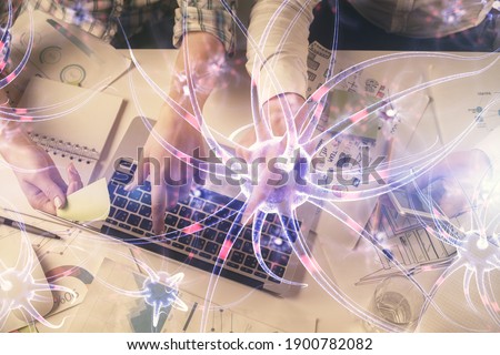 Double exposure of man and woman working together and neuron hologram drawing. Computer background. Top View. Education concept.