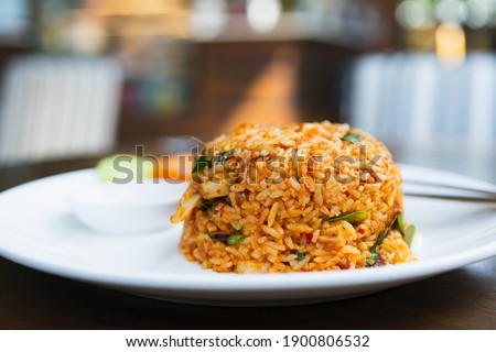 Tom Yum Kung Fried Rice close-up on background bokeh