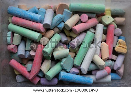 Box of colorful sidewalk chalk pieces
