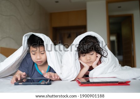 asian chinese child playing smartphone, children watching cartoon, kid use phone
