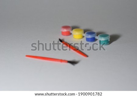 Cute Tiny Watercolour Brush and Paint Bottles with White Background 