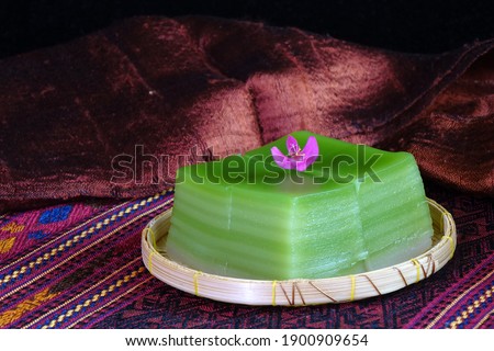 Thai dessert : Steamed Layer sweet cake (or Khanom Chan) Thai traditional dessert (Green Pandan flavour). One of nine famous Thai auspicious desserts in Thailand. Space for texts.
