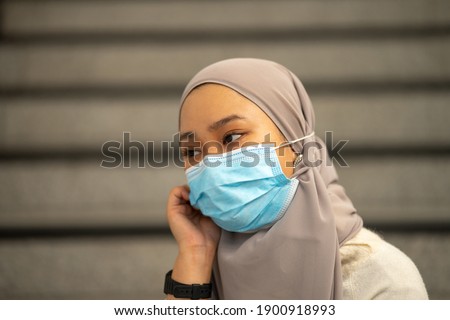 Young teenager wearing face mask with social distancing concept.