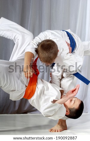 Training judo throw sportsman in judogi and with blue belt Royalty-Free Stock Photo #190092887