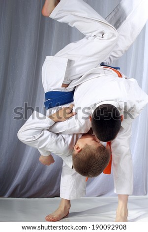 Nage-waza technique in performing by two athletes Royalty-Free Stock Photo #190092908