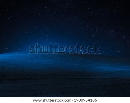 A blue desert night sky with stars